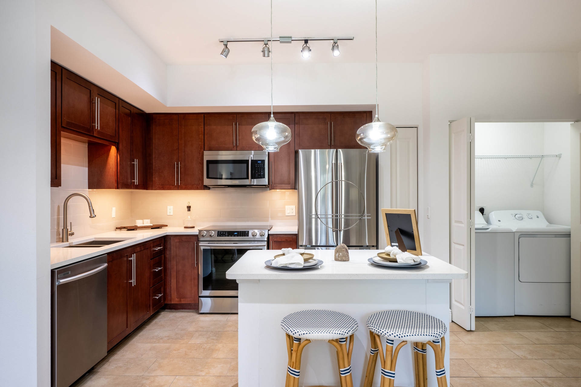 Open Concept Kitchen With Island and Stainless Steel Apliances